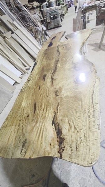 Close grain and figure across a wide dressed timber slab